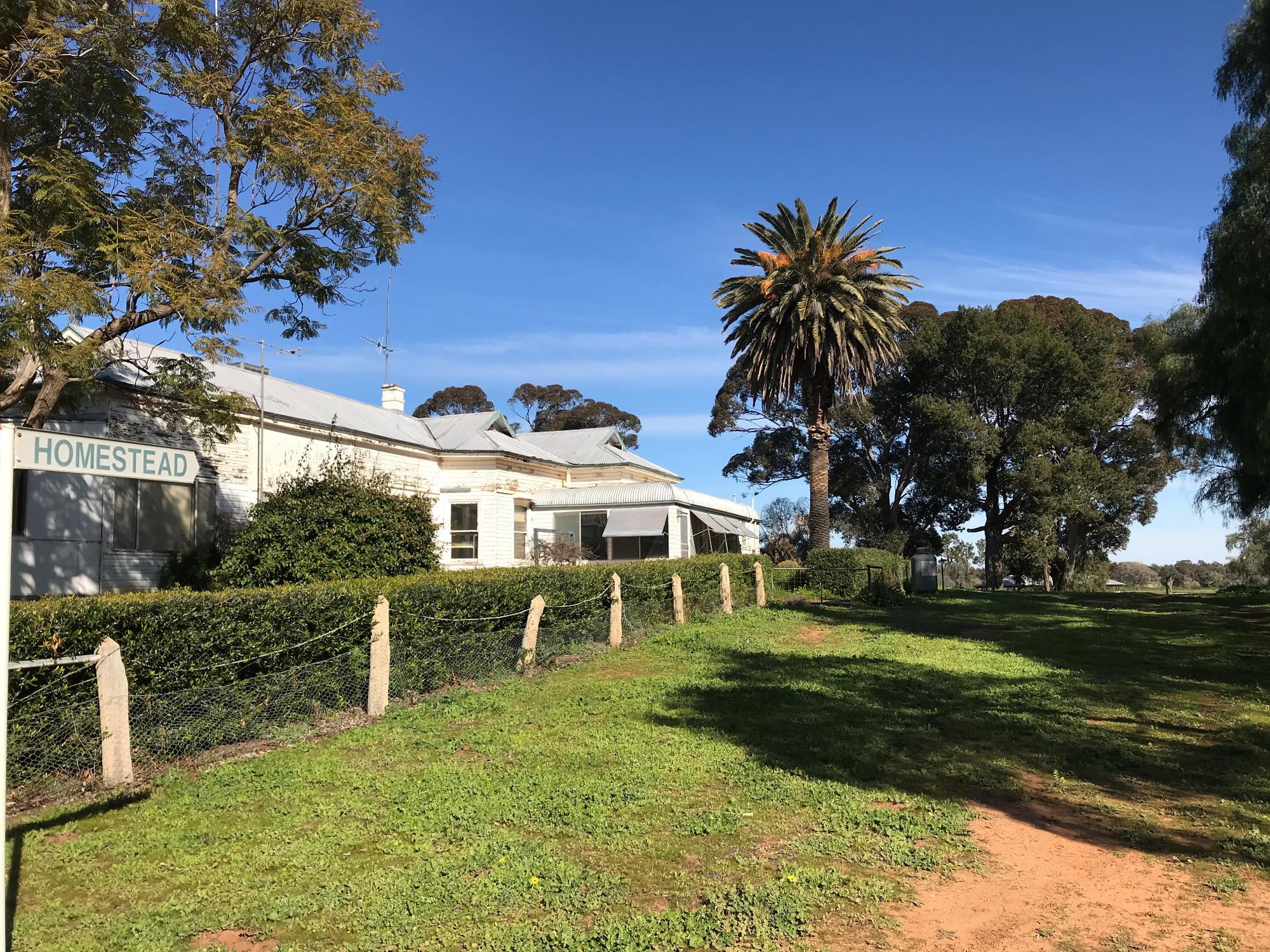 Historic farm house with fence