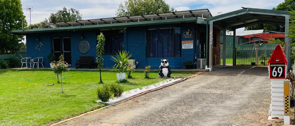 Blue front of house with grass