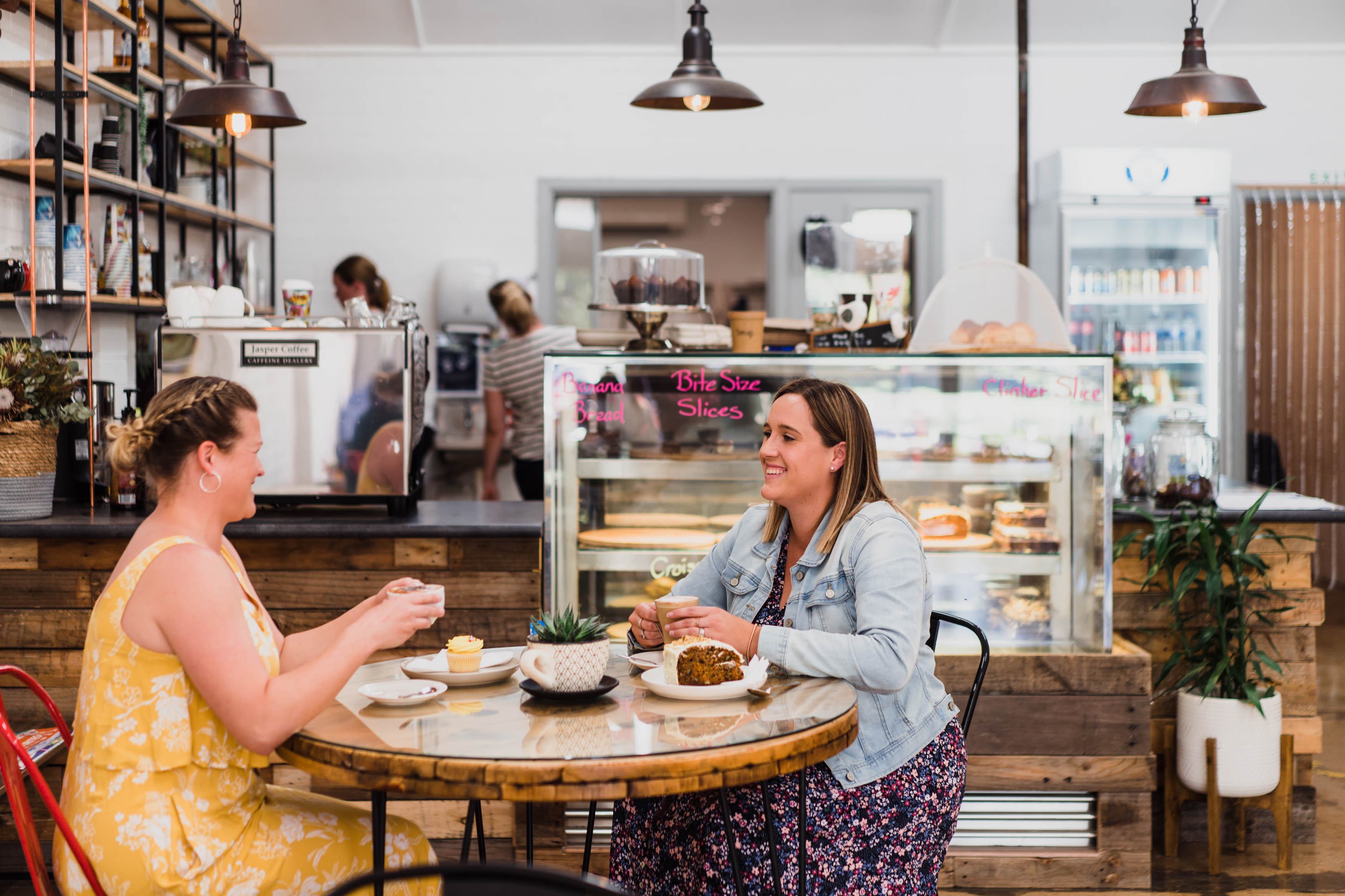 Two females sitting having a coffee in cafe